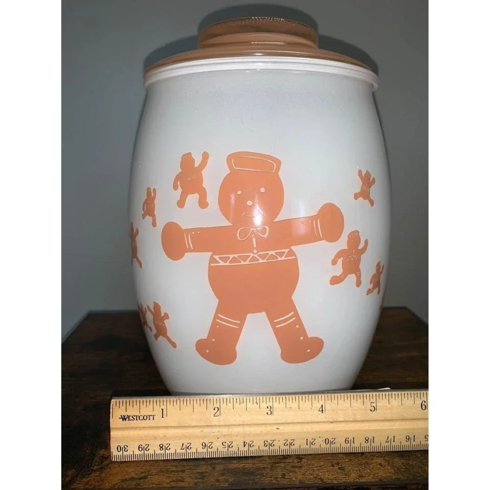 Vintage Bartlett Collins milk glass cookie jar featuring gingerbread man design